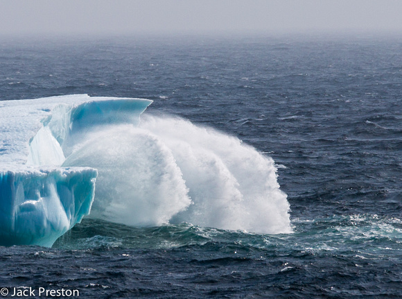 Iceberg getting hammered by rough seas